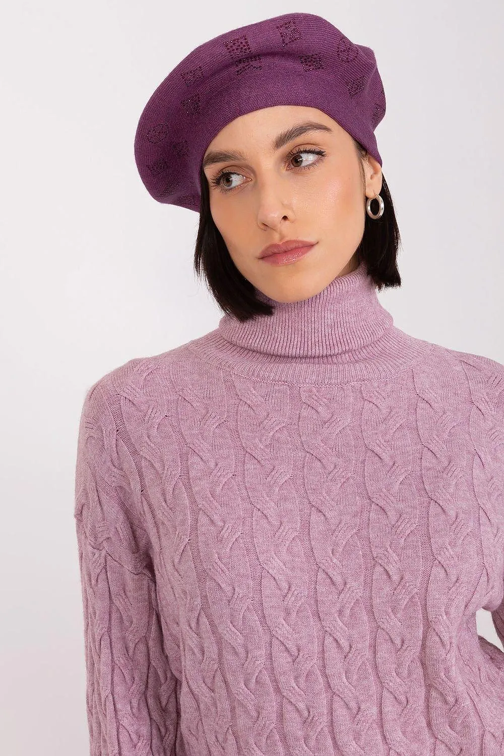 AT Knitted beret with interesting rhinestone application.