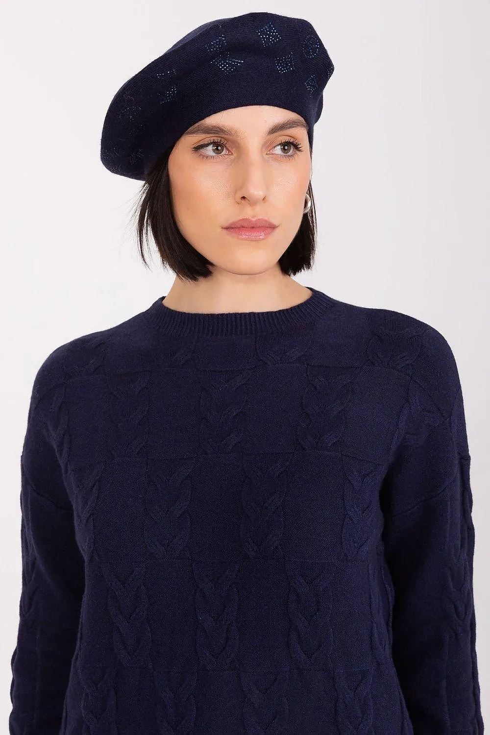 AT Knitted beret with interesting rhinestone application.